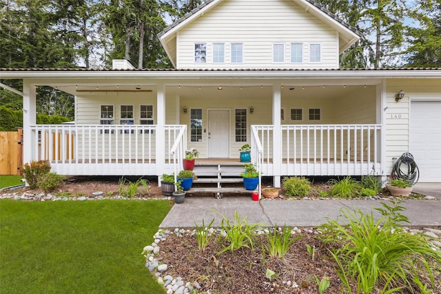 140 E Mountain View Dr, Allyn, WA 98524 - country-style home with a garage, covered porch, and a front lawn