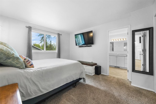 140 E Mountain View Dr, Allyn, WA 98524 - bedroom featuring light colored carpet, connected bathroom, and baseboards