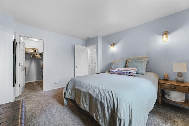 140 E Mountain View Dr, Allyn, WA 98524 - bedroom featuring carpet floors, a walk in closet, and baseboards