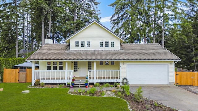 140 E Mountain View Dr, Allyn, WA 98524 - traditional-style house with a tiled roof, a gate, a porch, and a garage