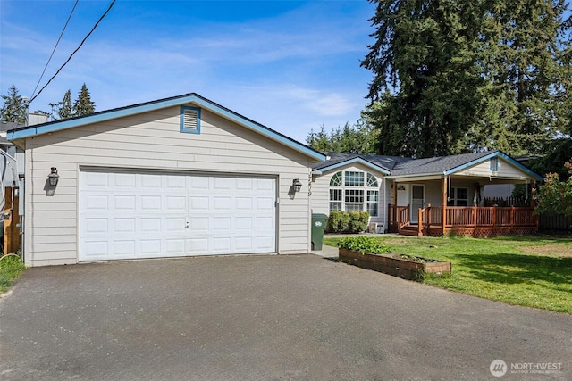 17419 11th Avenue Ct E, Spanaway, WA 98387 - single story home with a porch, a front yard, and a detached garage
