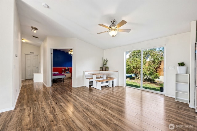 17419 11th Avenue Ct E, Spanaway, WA 98387 - empty room featuring ceiling fan, vaulted ceiling, wood finished floors, a smoke detector, and baseboards