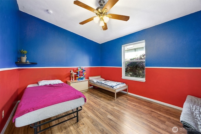 17419 11th Avenue Ct E, Spanaway, WA 98387 - bedroom with wood finished floors, a ceiling fan, and baseboards