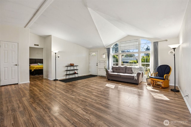 17419 11th Avenue Ct E, Spanaway, WA 98387 - living area featuring wood finished floors, high vaulted ceiling, and baseboards
