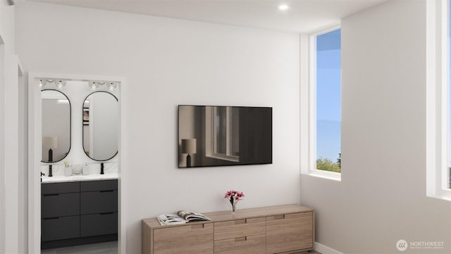 1223 N 48th St, Seattle, WA 98103 - bedroom with connected bathroom and baseboards