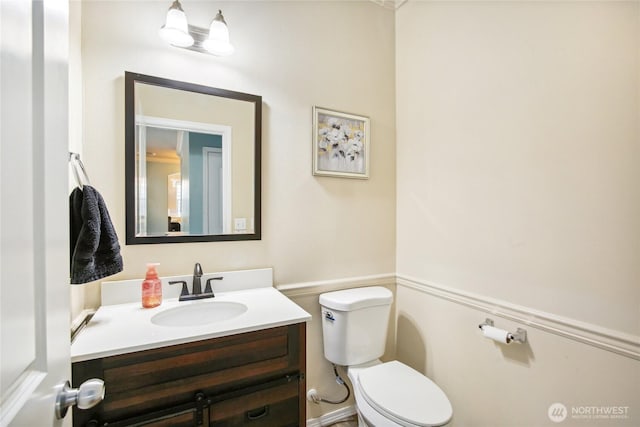 2529 10th Ct SE, Olympia, WA 98501 - bathroom with toilet, vanity, and wainscoting