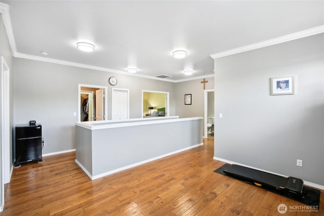 2529 10th Ct SE, Olympia, WA 98501 - unfurnished room with wood-type flooring, ornamental molding, and baseboards