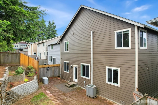 2529 10th Ct SE, Olympia, WA 98501 - back of house featuring a patio, central air condition unit, and entry steps