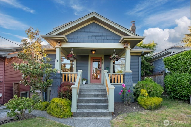 528 N 83rd St, Seattle, WA 98103 - view of front of home featuring a chimney and covered porch