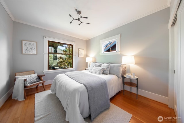 528 N 83rd St, Seattle, WA 98103 - bedroom with light wood-type flooring, ornamental molding, and baseboards