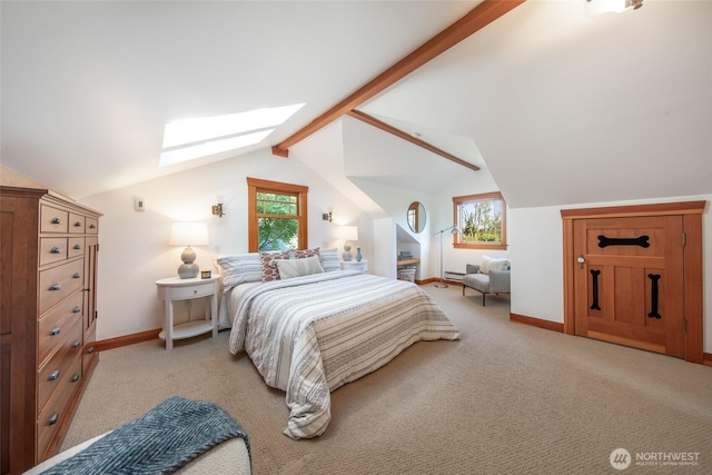 528 N 83rd St, Seattle, WA 98103 - bedroom with a skylight, light carpet, and baseboards