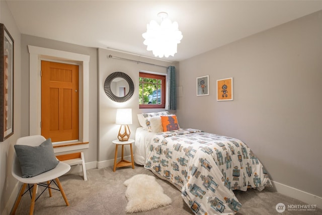 528 N 83rd St, Seattle, WA 98103 - bedroom featuring carpet, baseboards, and a chandelier