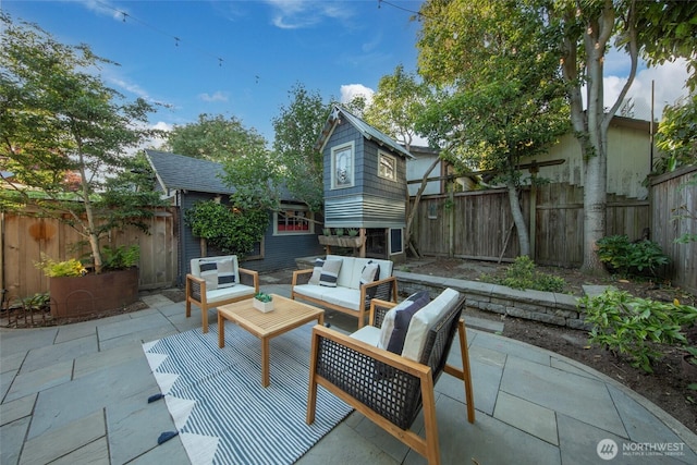 528 N 83rd St, Seattle, WA 98103 - fenced backyard featuring a patio area, an outdoor hangout area, and an outdoor structure