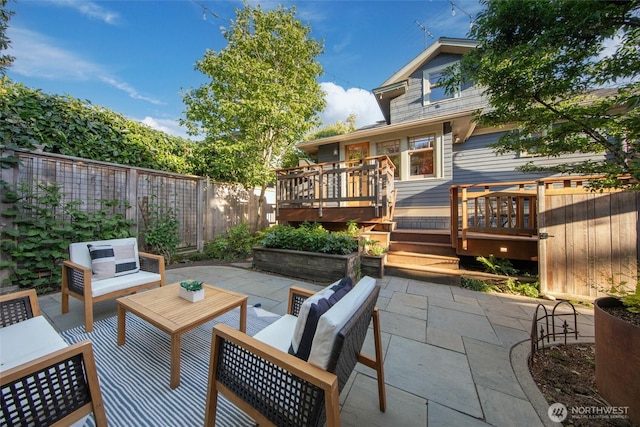 528 N 83rd St, Seattle, WA 98103 - fenced backyard with a patio, a deck, and an outdoor hangout area