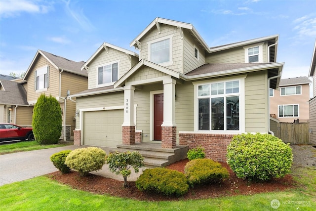 3808 Wildspitz St SE, Lacey, WA 98503 - craftsman-style house with a garage, brick siding, and driveway