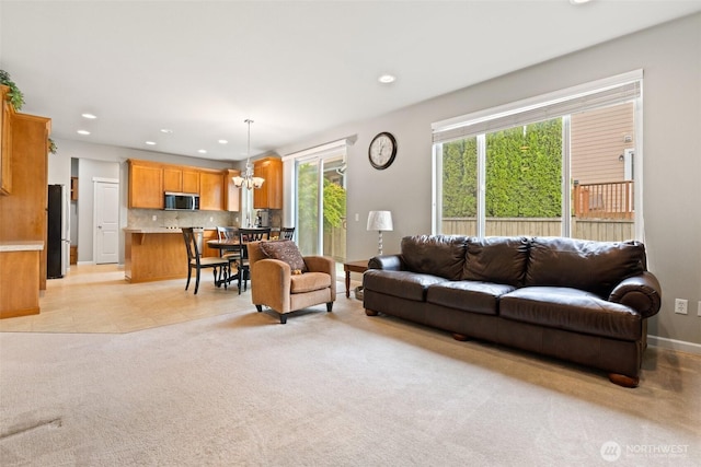 3808 Wildspitz St SE, Lacey, WA 98503 - living area featuring recessed lighting, light carpet, and baseboards