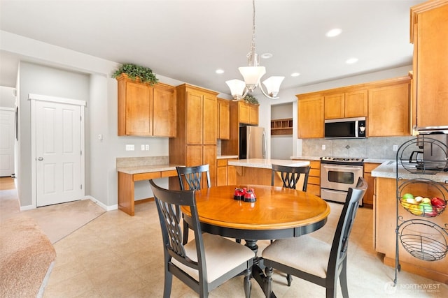 3808 Wildspitz St SE, Lacey, WA 98503 - dining area with recessed lighting, a chandelier, and baseboards