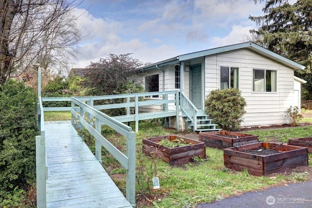 7300 V Pl, Long Beach, WA 98631 - view of front facade featuring a vegetable garden