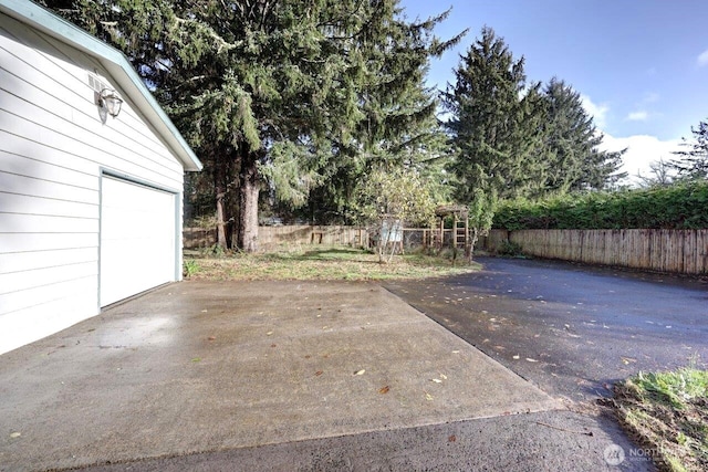 7300 V Pl, Long Beach, WA 98631 - view of patio featuring driveway and a garage