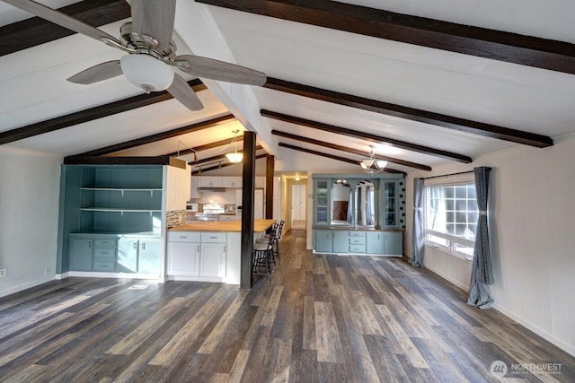 7300 V Pl, Long Beach, WA 98631 - unfurnished living room featuring dark wood-style flooring, ceiling fan, and baseboards