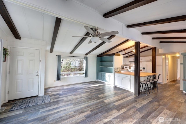 7300 V Pl, Long Beach, WA 98631 - living area featuring dark wood-type flooring, a ceiling fan, and baseboards