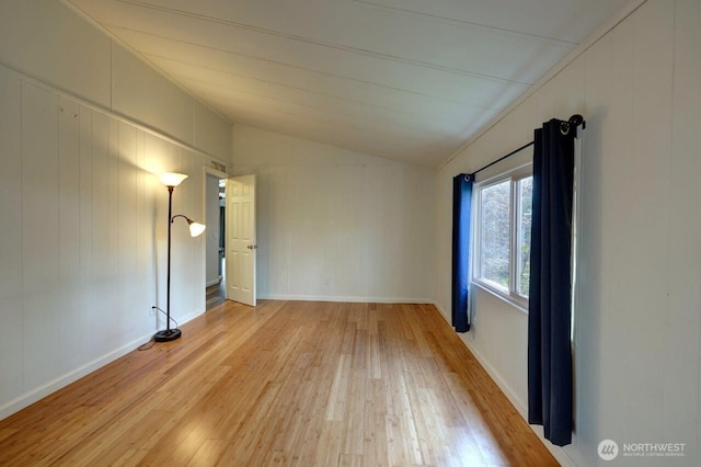 7300 V Pl, Long Beach, WA 98631 - unfurnished room with vaulted ceiling, light wood-style flooring, and baseboards
