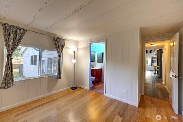 7300 V Pl, Long Beach, WA 98631 - unfurnished bedroom featuring light wood-type flooring, baseboards, and ensuite bath