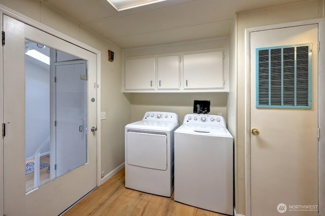 7300 V Pl, Long Beach, WA 98631 - laundry room featuring cabinet space, light wood-type flooring, and separate washer and dryer