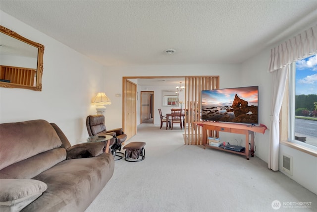 284 Division Ave, Morton, WA 98356 - carpeted living room featuring a textured ceiling