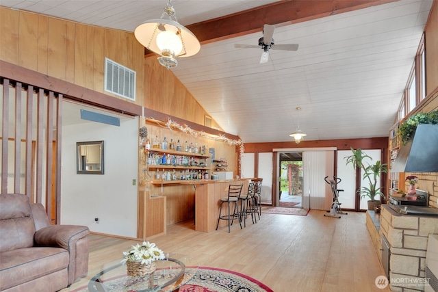 284 Division Ave, Morton, WA 98356 - living room with vaulted ceiling, wood finished floors, a bar, and a ceiling fan
