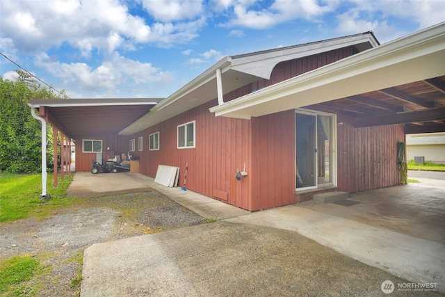 284 Division Ave, Morton, WA 98356 - view of home's exterior featuring a carport, a patio area, and driveway
