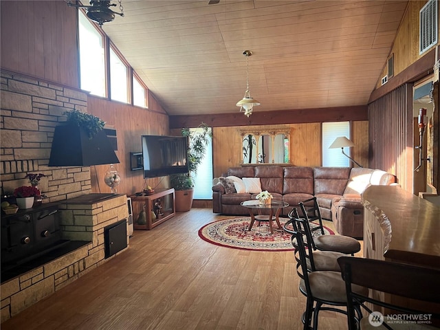 284 Division Ave, Morton, WA 98356 - living area with lofted ceiling, wooden walls, plenty of natural light, wood finished floors, and wooden ceiling