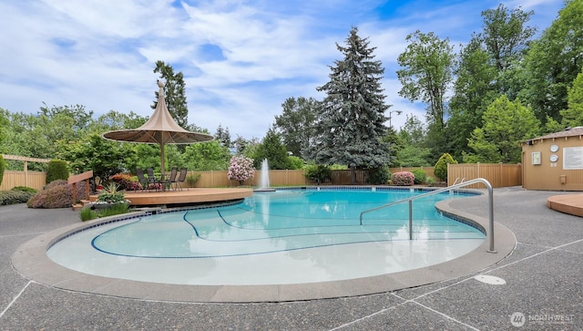8005 Sand Point Way NE Unit A45, Seattle, WA 98115 - community pool with a wooden deck, a fenced backyard, and a patio area