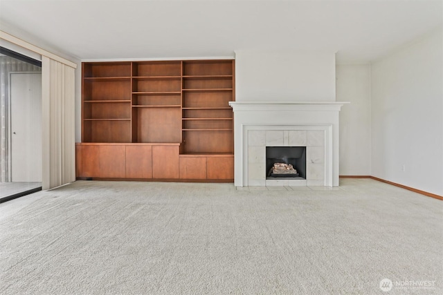8005 Sand Point Way NE Unit A45, Seattle, WA 98115 - unfurnished living room featuring light colored carpet and a fireplace