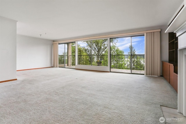 8005 Sand Point Way NE Unit A45, Seattle, WA 98115 - unfurnished living room with carpet floors and baseboards