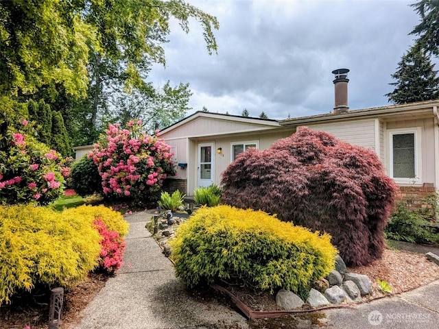 4118 21st Street Pl SE, Puyallup, WA 98374 - view of front facade with a chimney