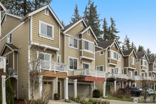 1045 156th Ave NE, Bellevue, WA 98007 - view of front of house with a garage, driveway, and a residential view