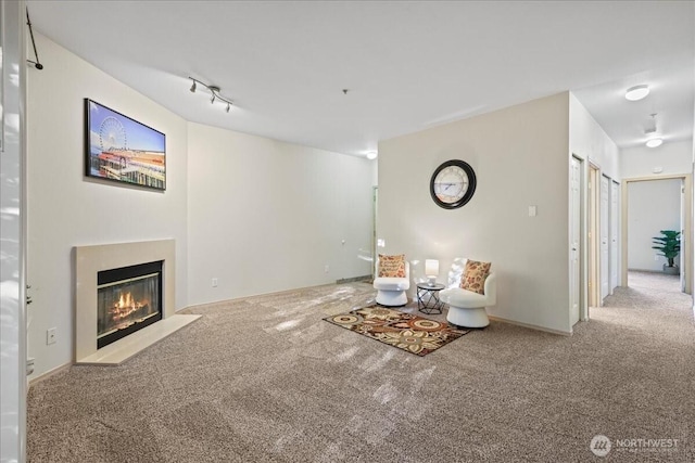 18930 Bothell Everett Hwy Unit V201, Bothell, WA 98012 - living area featuring carpet floors, a fireplace with flush hearth, and track lighting
