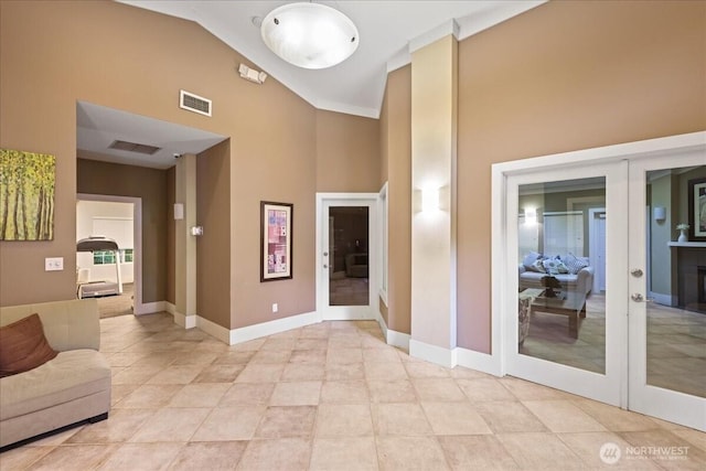 18930 Bothell Everett Hwy Unit V201, Bothell, WA 98012 - foyer with french doors, high vaulted ceiling, baseboards, and light tile patterned floors