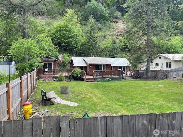 48 Blue Jay Loop, Walla Walla, WA 99362 - view of yard featuring a wooden deck and a view of trees