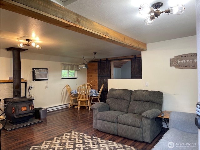 48 Blue Jay Loop, Walla Walla, WA 99362 - living area with an AC wall unit, wood finished floors, a wood stove, beamed ceiling, and a baseboard radiator