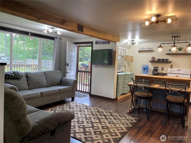 48 Blue Jay Loop, Walla Walla, WA 99362 - living area featuring healthy amount of natural light, dark wood-style flooring, bar, baseboards, and beam ceiling