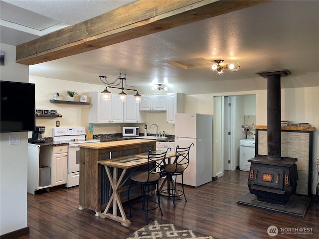 48 Blue Jay Loop, Walla Walla, WA 99362 - kitchen with white appliances, a sink, washer / dryer, and white cabinets