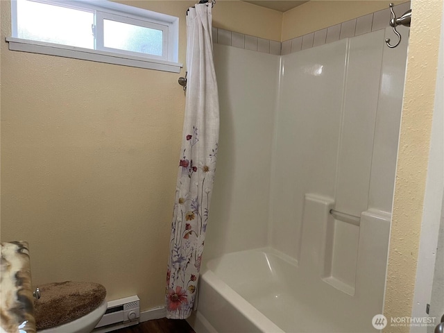 48 Blue Jay Loop, Walla Walla, WA 99362 - full bathroom featuring shower / bathtub combination with curtain, toilet, wood finished floors, and baseboards