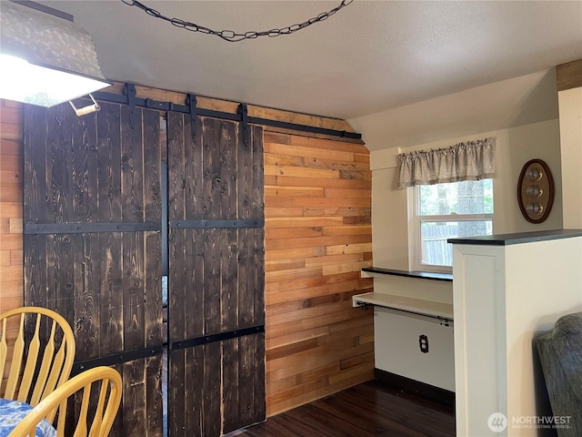 48 Blue Jay Loop, Walla Walla, WA 99362 - kitchen featuring wood finished floors, vaulted ceiling, and wooden walls