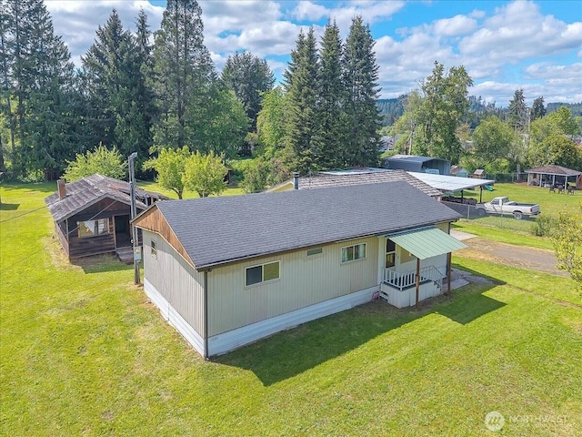 315 Washington St, Pe Ell, WA 98572 - back of property featuring a shingled roof, a lawn, and a porch