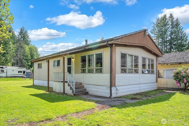 315 Washington St, Pe Ell, WA 98572 - rear view of house featuring a lawn and entry steps