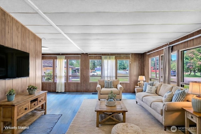 315 Washington St, Pe Ell, WA 98572 - living area featuring wood walls, healthy amount of natural light, and light wood-type flooring