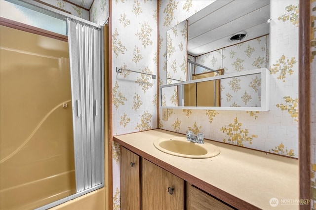 315 Washington St, Pe Ell, WA 98572 - bathroom featuring wallpapered walls, vanity, and washtub / shower combination