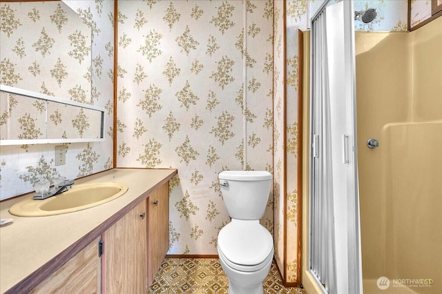 315 Washington St, Pe Ell, WA 98572 - full bath featuring a stall shower, vanity, toilet, wallpapered walls, and baseboards